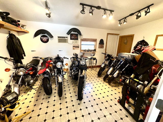 garage featuring a wall mounted air conditioner