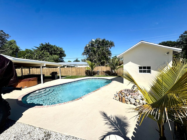 view of pool featuring a patio area, a hot tub, a fenced in pool, and a fenced backyard