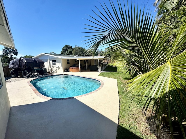 view of swimming pool with a fenced in pool and a patio