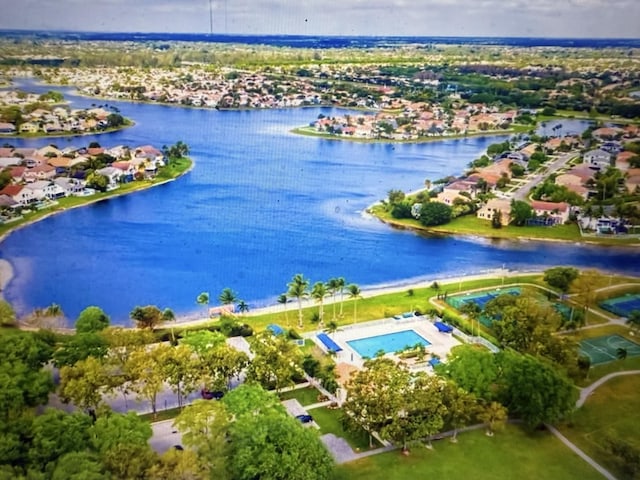 birds eye view of property featuring a water view