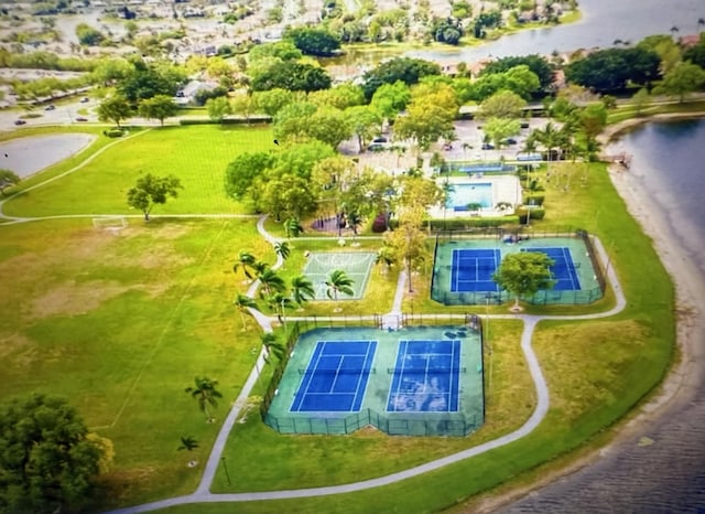 birds eye view of property with a water view