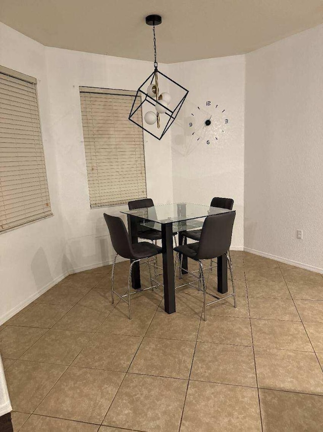 dining room with baseboards and tile patterned floors