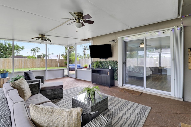 view of patio with fence, an outdoor living space, and a ceiling fan