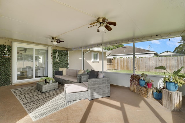 sunroom / solarium with a ceiling fan