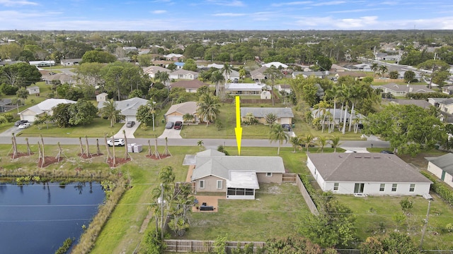 bird's eye view with a water view and a residential view