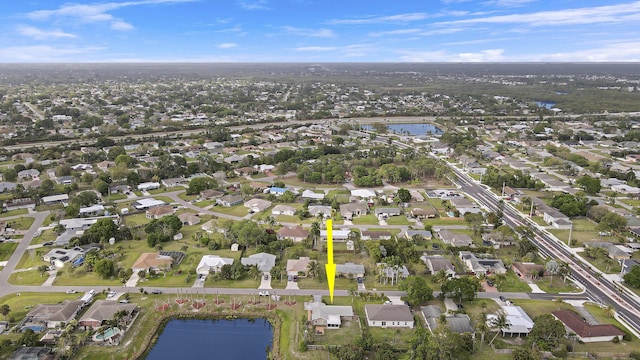 bird's eye view with a water view and a residential view