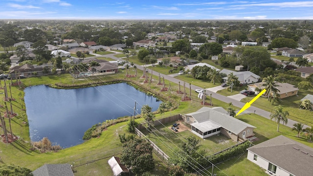 aerial view featuring a residential view and a water view