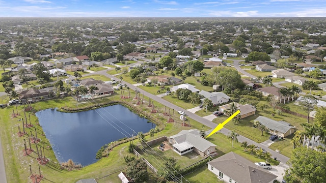 bird's eye view featuring a water view and a residential view