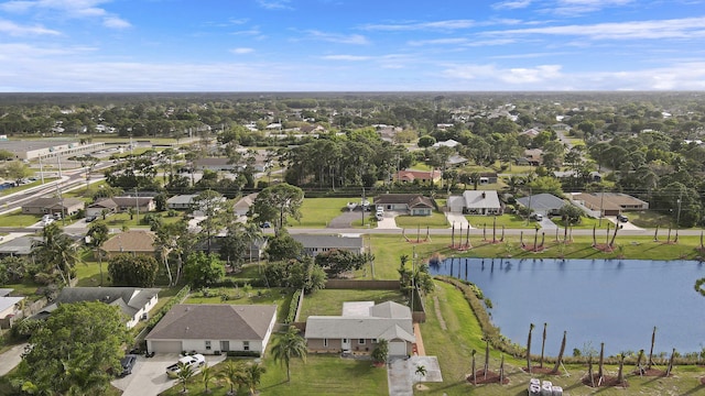 aerial view with a residential view and a water view