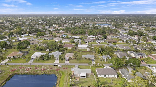 birds eye view of property with a water view and a residential view