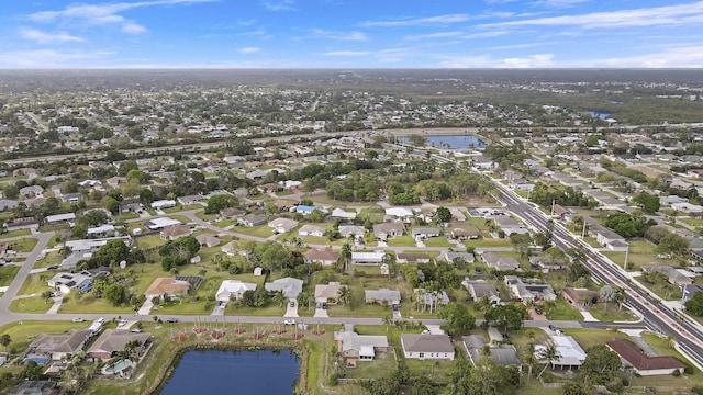 aerial view featuring a water view and a residential view