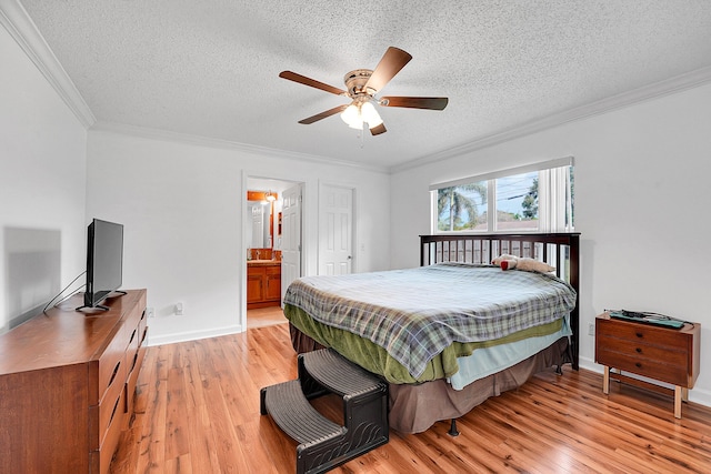 bedroom featuring crown molding, a textured ceiling, baseboards, and light wood-style floors