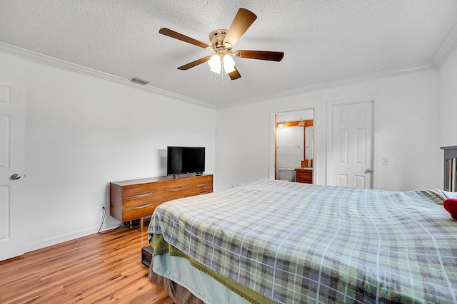 bedroom with visible vents, a ceiling fan, wood finished floors, crown molding, and a textured ceiling