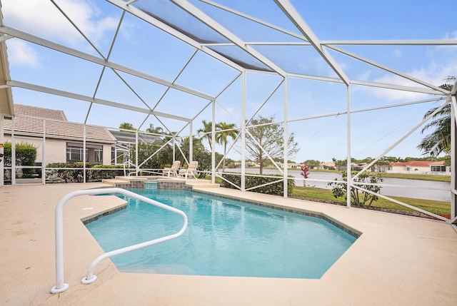 view of pool with glass enclosure, a patio area, and a pool with connected hot tub