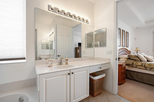 bathroom featuring a garden tub, a shower stall, visible vents, and vanity