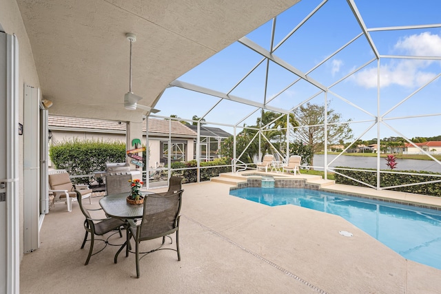 view of swimming pool with a lanai, a pool with connected hot tub, and a patio