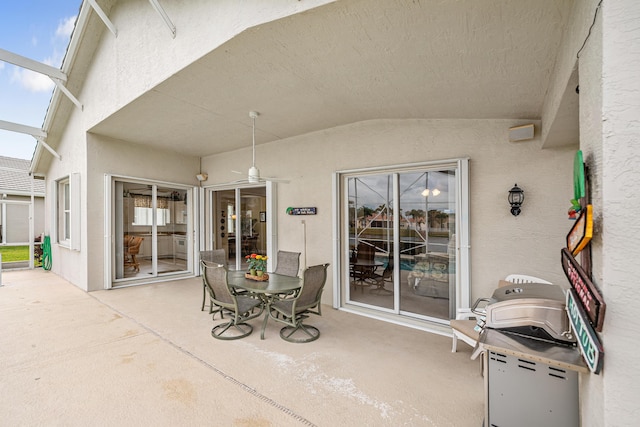 view of patio with glass enclosure