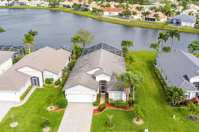 drone / aerial view with a residential view and a water view