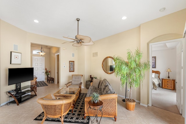 living area featuring light tile patterned floors, baseboards, visible vents, and recessed lighting