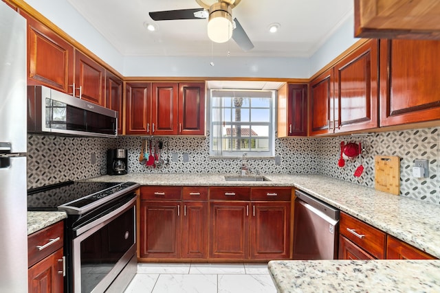 kitchen with reddish brown cabinets, marble finish floor, appliances with stainless steel finishes, and a sink