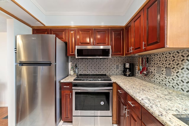 kitchen with light stone counters, appliances with stainless steel finishes, reddish brown cabinets, tasteful backsplash, and crown molding