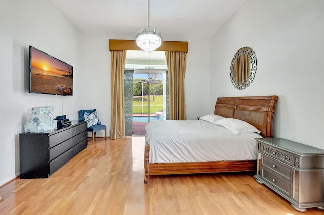19035 Cypress Crik Ct, Boca Raton, FL 33498 - bedroom featuring light wood-style flooring and access to exterior