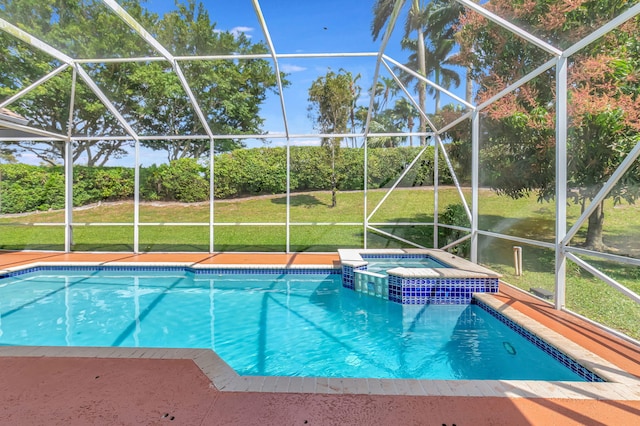 view of pool featuring glass enclosure, a yard, a patio area, and a pool with connected hot tub