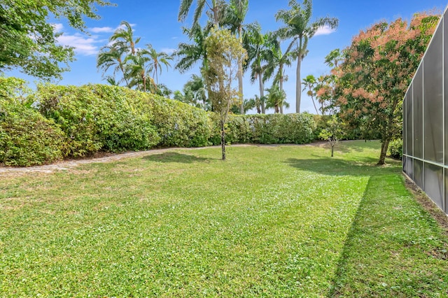 view of yard with a lanai