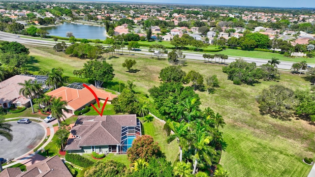 birds eye view of property featuring a water view and a residential view