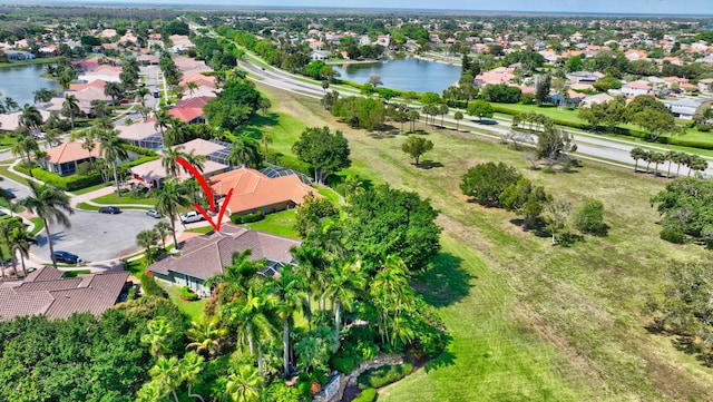 aerial view featuring a water view and a residential view