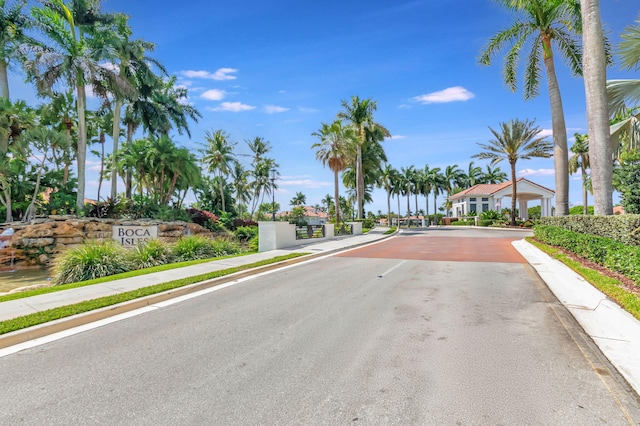 view of road with sidewalks and curbs