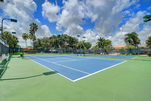 view of sport court with community basketball court and fence