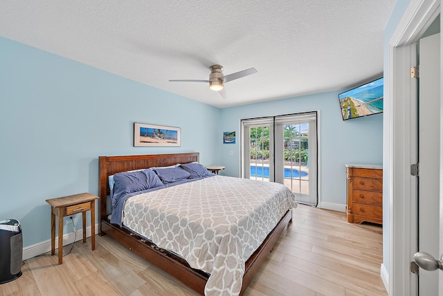 bedroom with access to exterior, baseboards, and light wood finished floors