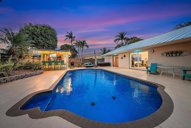 view of pool featuring a fenced backyard, a playground, a fenced in pool, and a patio