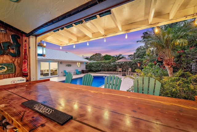 view of pool with a fenced in pool, a patio area, and fence