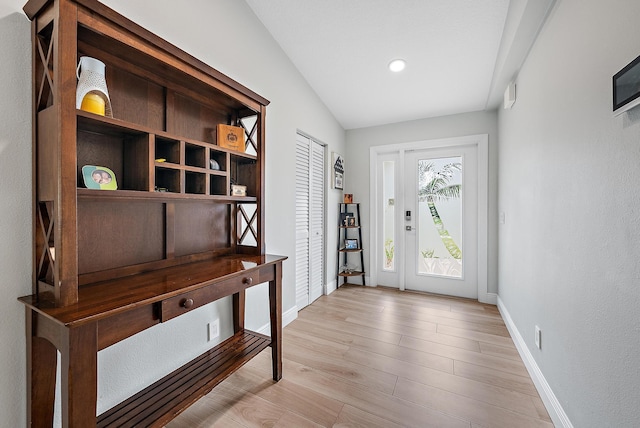 interior space with light wood-style floors and baseboards