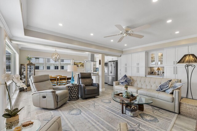 living room with ceiling fan, light wood-style floors, recessed lighting, and crown molding