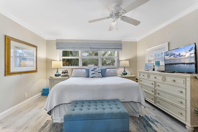 bedroom featuring baseboards, light wood-style floors, a ceiling fan, and crown molding