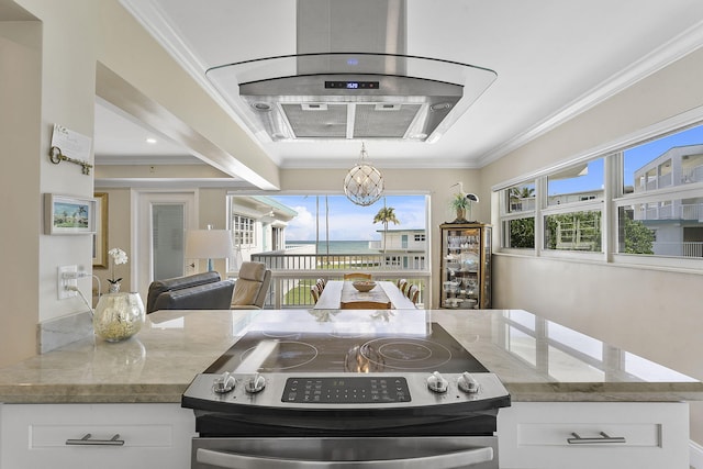 kitchen with stone countertops, ornamental molding, white cabinets, and stainless steel range with electric cooktop