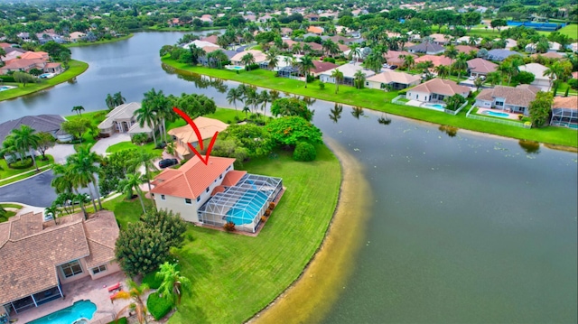 drone / aerial view with a water view and a residential view