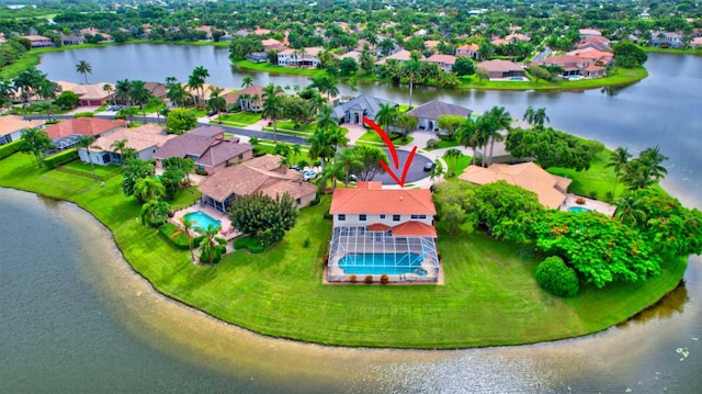 drone / aerial view with a water view and a residential view