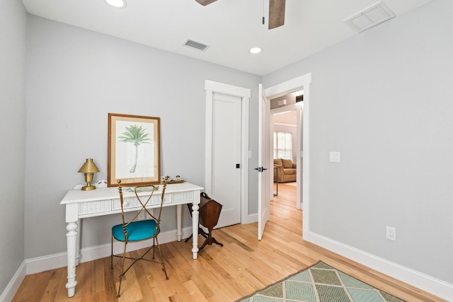 office space with recessed lighting, light wood-type flooring, visible vents, and baseboards