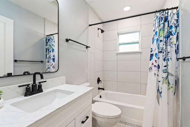 full bath with shower / bath combo, vanity, and toilet