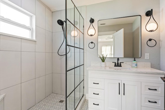 full bathroom with a walk in shower and vanity