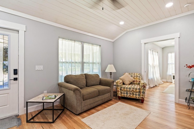 living room featuring wood ceiling, baseboards, vaulted ceiling, ornamental molding, and light wood finished floors