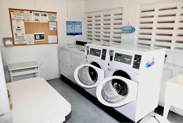 shared laundry area with washing machine and clothes dryer