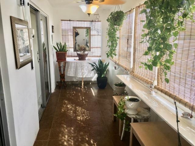 hall with tile patterned floors