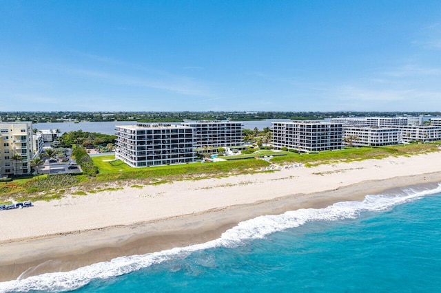 aerial view with a water view, a view of city, and a view of the beach