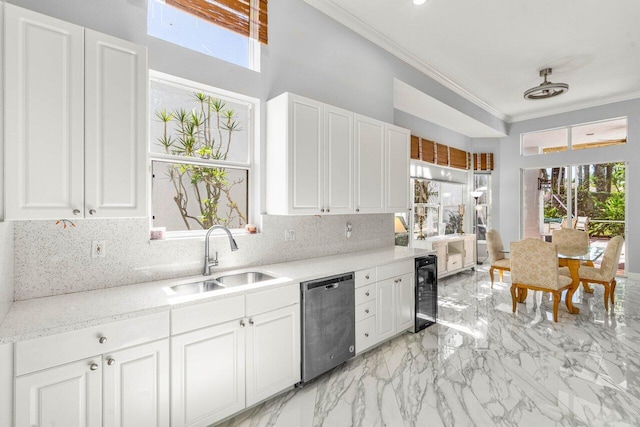 kitchen featuring a sink, decorative backsplash, wine cooler, stainless steel dishwasher, and crown molding