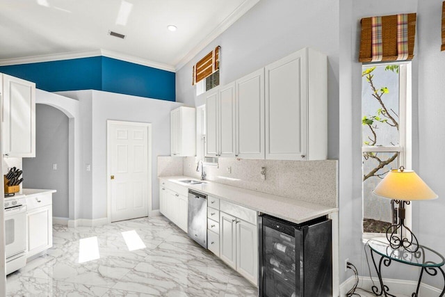 kitchen featuring beverage cooler, white gas range oven, arched walkways, marble finish floor, and stainless steel dishwasher